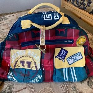 Victoria’s Secret rolling suitcase. Worn condition